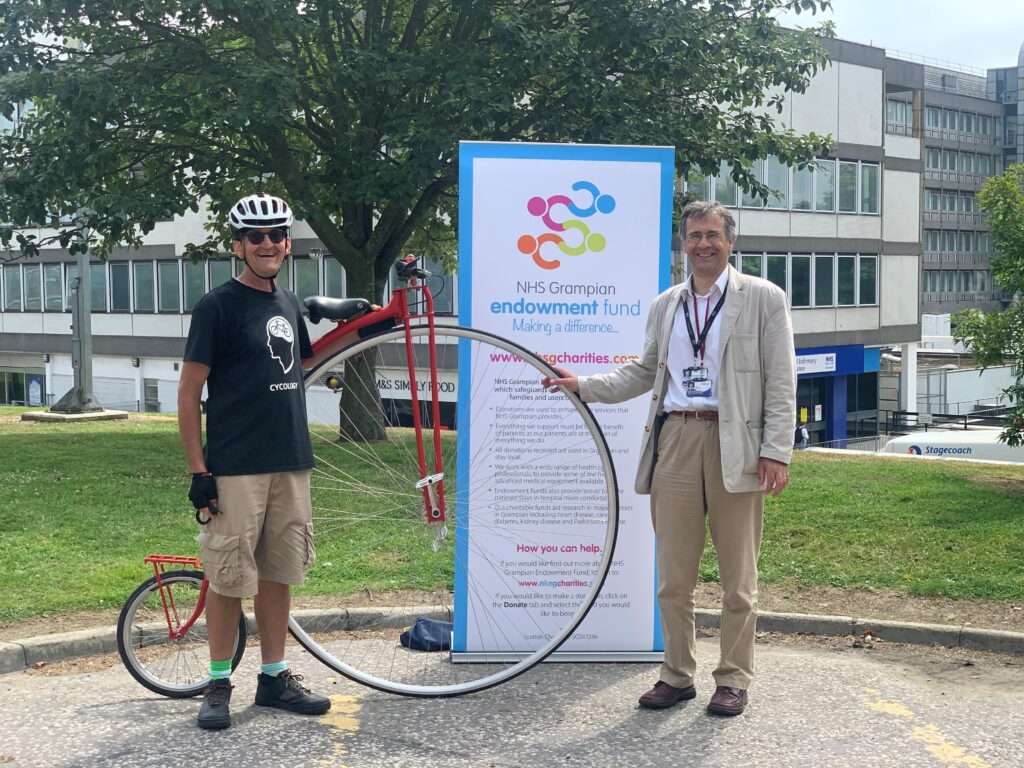 Carl Counsell, Consultant Neurologist congratulating James at the end of this ride